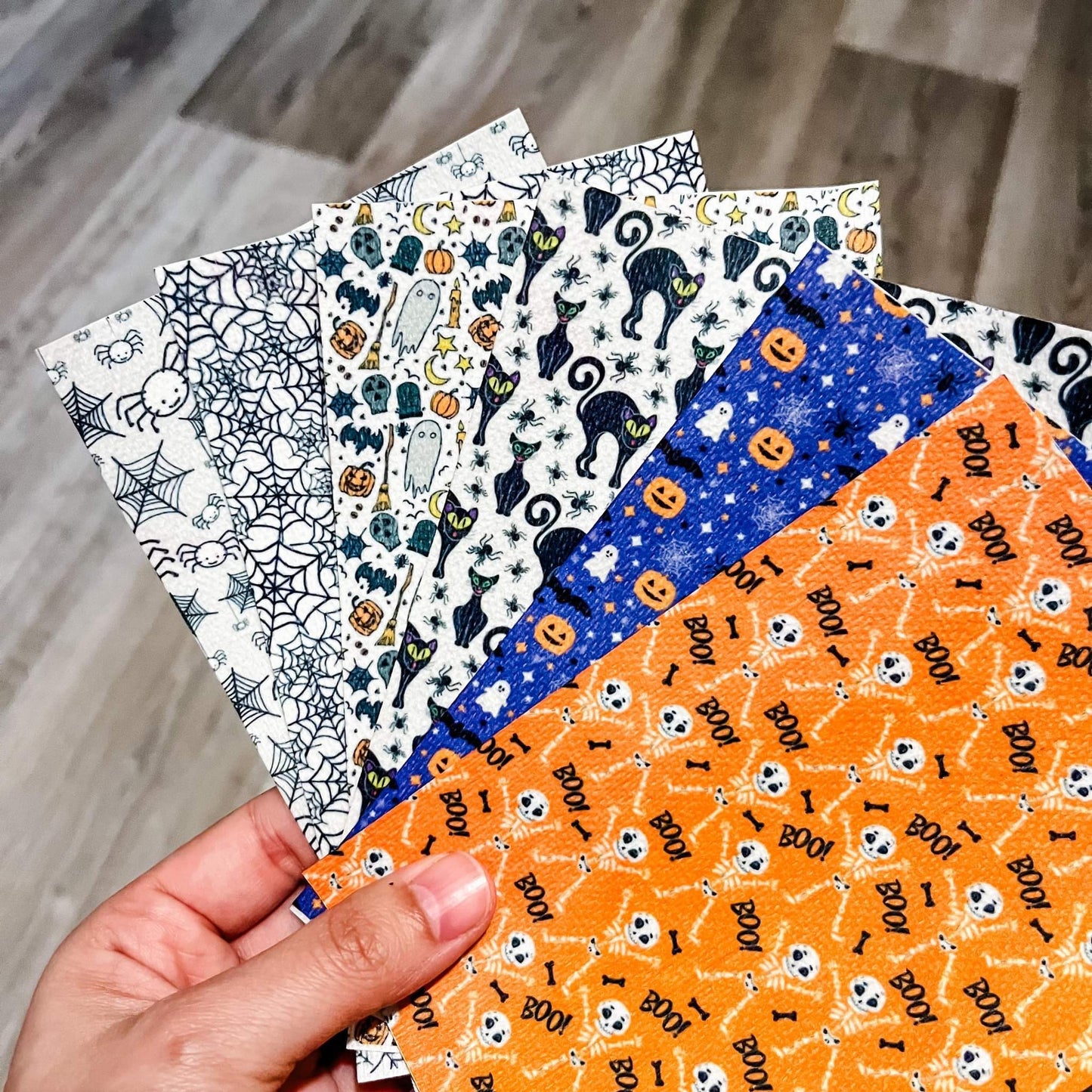 hand holding six different halloween themed hypafix tapes